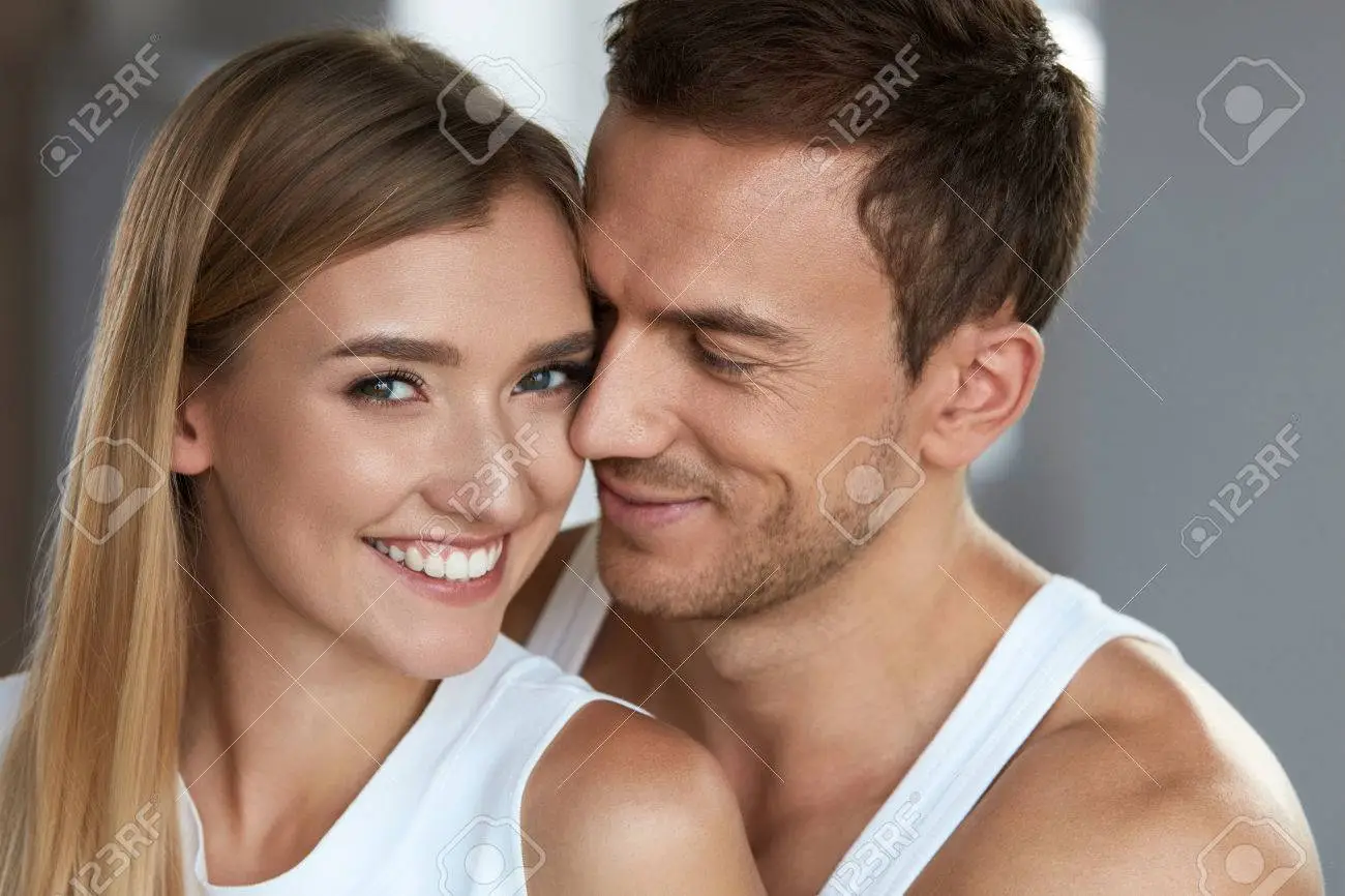 love-and-care-closeup-happy-beautiful-lovely-couple-smiling-woman-with-fresh-soft-face-skin-and-hand