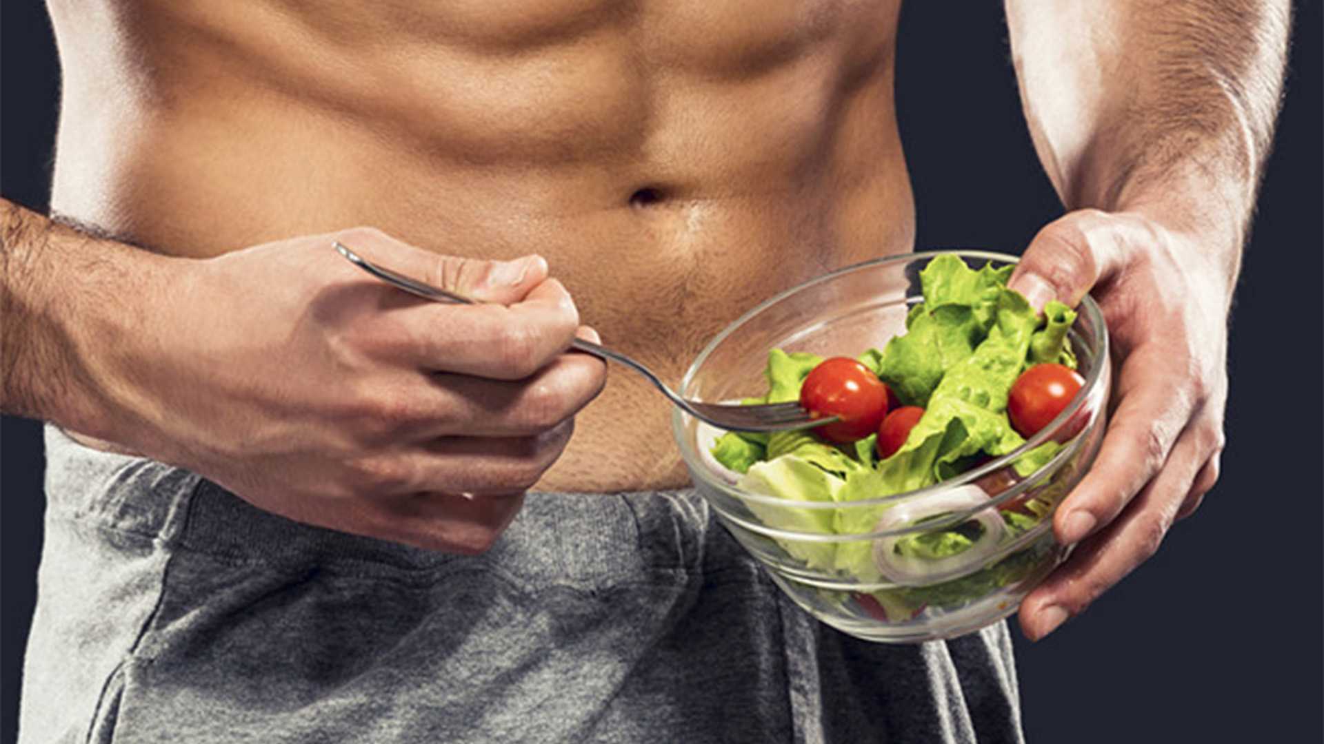 Food-intolerance-eat-healthy-fitness-guy-with-abs-salad