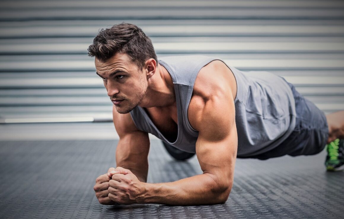 muscular-man-on-plank-position-royalty-free-image